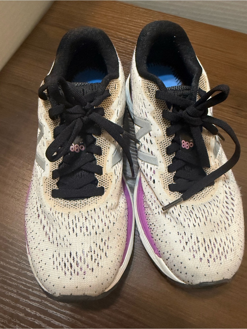 New Balance Women's Cream and Black Running Shoes with Purple Detail